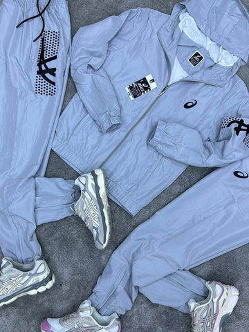 Chandal Asics *reflectante* gris