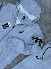 Chandal Asics *reflectante* gris