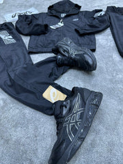 Chandal Asics *reflectante* negro